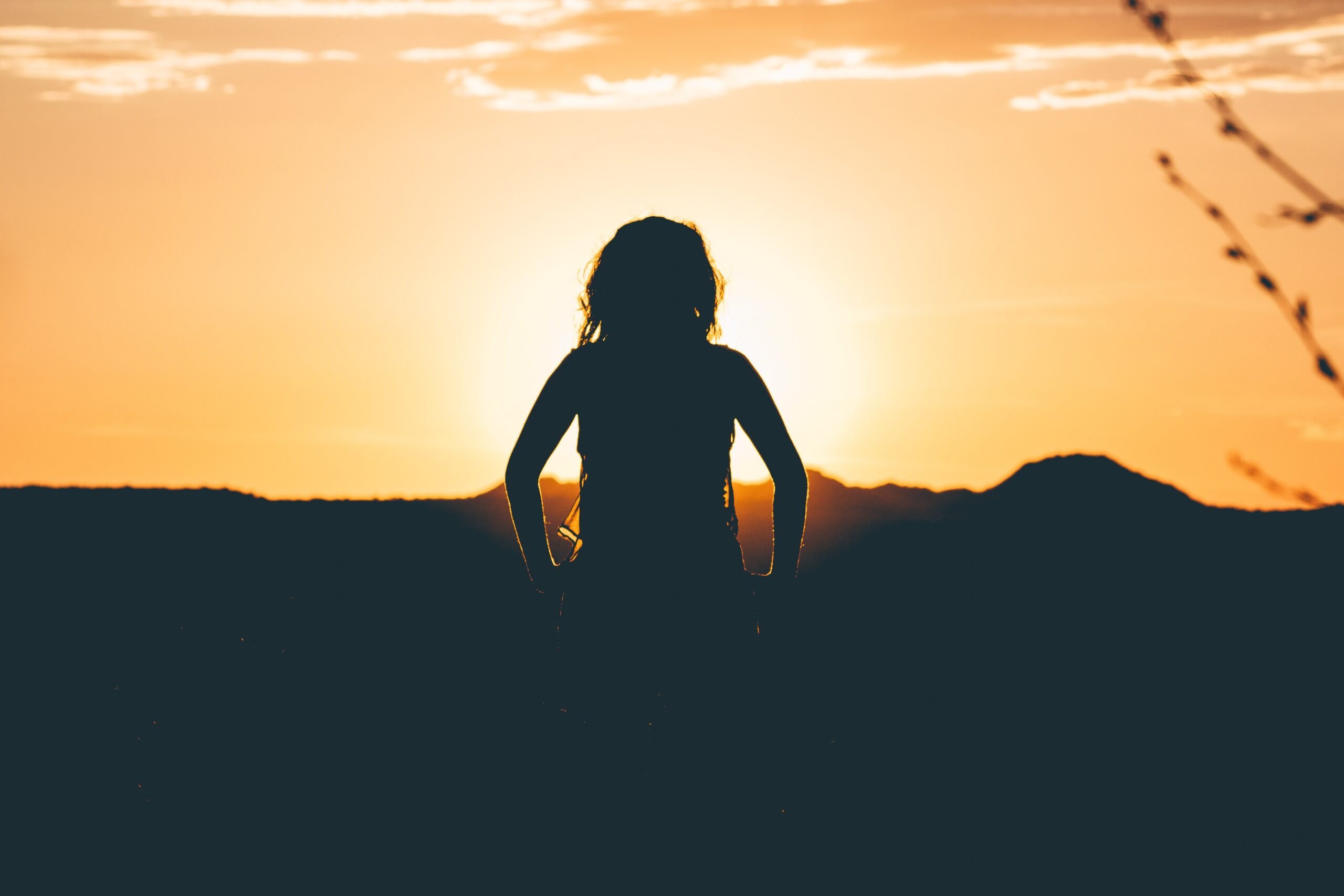 A silhouette of a child at sunset for The Case Against Spanking blog 