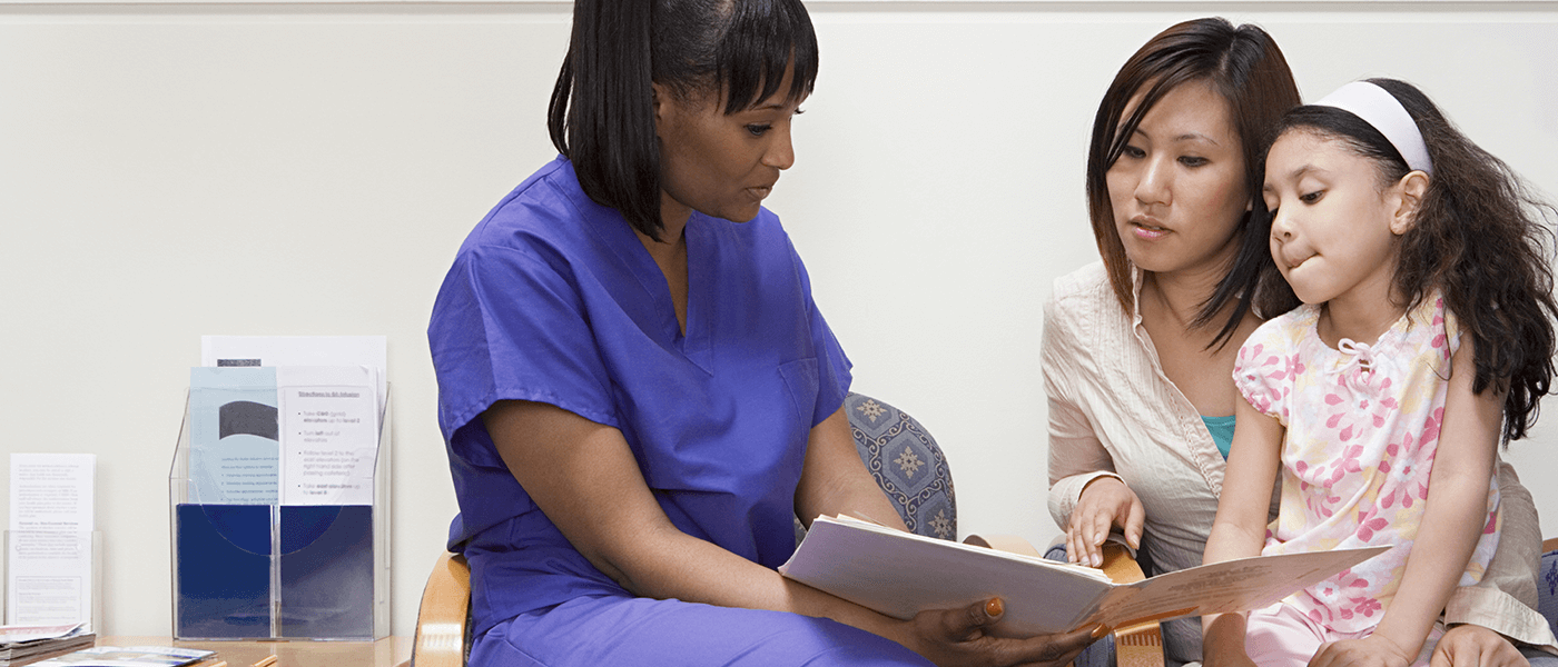 nurse with mother and daughter