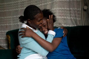 Mother and daughter hugging