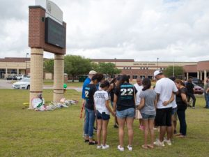 santa fe shooting - a group of Santa Fe students standing in a prayer circle