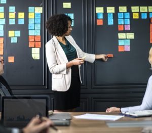 learning and evaluation - African American woman leading a brainstorming session