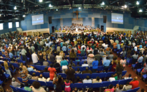 Diverse group of people congregate in a faith church
