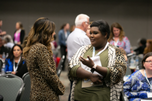 Two women in discussion during the 2019 Robert Lee Sutherland Seminar 