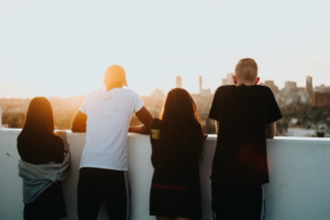 A photo of young adults watching a sunset