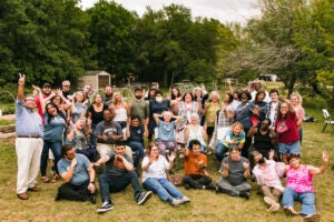 Group of people pose for photo.