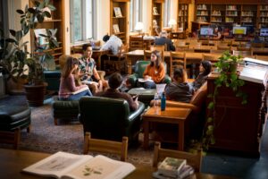 A group of University of Texas at Austin students studying together at the library.