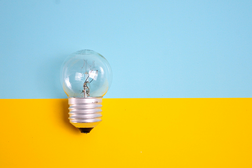 innovation-web lightbulb laid over bright colors
