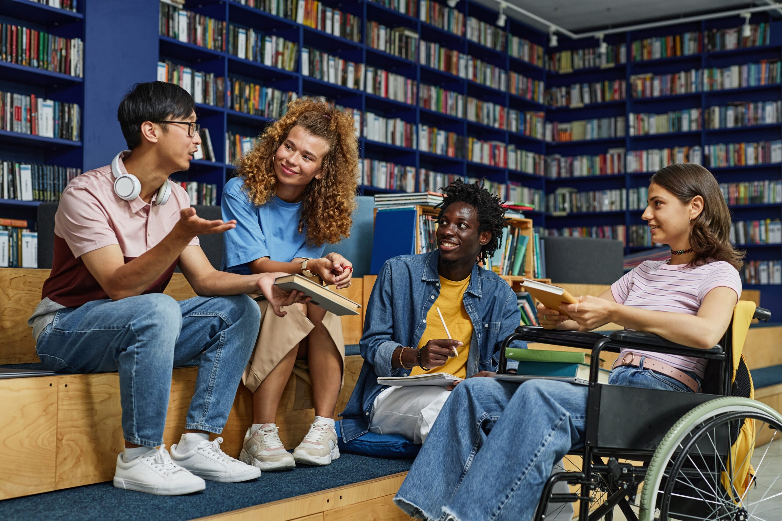Young adults talking in library