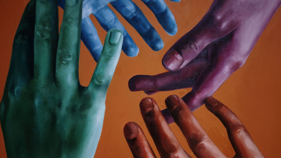 Colorful hands raised.