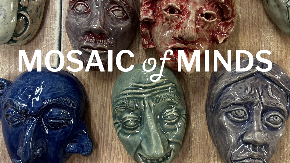 Close-up of ceramic human faces showing different emotions.